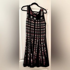 Black with white and pink accents and flattering a-line detail. Cotton & rayon